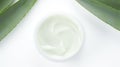 Aloe vera cream with aloe vera leaves on white