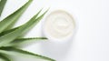 Aloe vera cream with aloe vera leaves on white