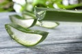 Aloe vera juice dripping from green leaf, closeup Royalty Free Stock Photo