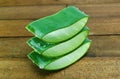 Stack of Aloe vera sliced on wooden background.