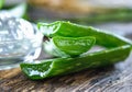 Aloe Vera leaves on wooden background