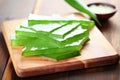 aloe vera slices on a wooden board