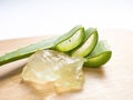 Aloe vera star cactus slide and vera gel Isolated on brown wooden background