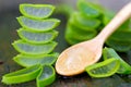 Aloe vera on wooden spoon on wooden table There are many useful herbs