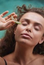 Aloe Woman. Girl Holding Slices Of Fresh Juicy Aloe Vera Leaf Near Her Face Royalty Free Stock Photo