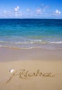 Aloha is written in the sand Royalty Free Stock Photo