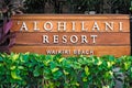 \'Alohilani Resort Waikiki Beach luxury beachfront hotel wood sign on Kalakaua Ave on Oahu Island. Royalty Free Stock Photo