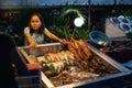 Young woman sell seafood on street market, Philippines Royalty Free Stock Photo