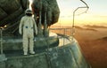 Alone astronaut on alien planet. Martian on metal base. Future concept. 3d rendering. Royalty Free Stock Photo