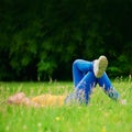 Alone is a beautiful place to be. a young woman lying down in a field of grass. Royalty Free Stock Photo