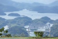 The alone bench on the top of mountain. around the TaDung Lake, white cloud on the blue sky Royalty Free Stock Photo