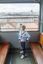 alone boy climb in an empty funicular and look at the panorama o Royalty Free Stock Photo