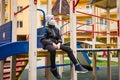 Alone boy with medical mask is sitting