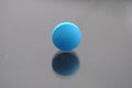 Alone bright blue round tablet Royalty Free Stock Photo