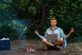 Alone businessman with laptop at fireplace, island Royalty Free Stock Photo