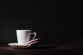 Alone cup of espesso coffee on Dark Style Black background