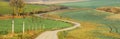 Alone curved farm road in autumn fields Royalty Free Stock Photo