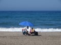 Alone on an empty beach on vacation Royalty Free Stock Photo