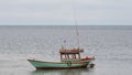 Alone Fishing Boat in a sea. Royalty Free Stock Photo