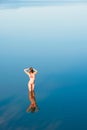 Alone girl in water Royalty Free Stock Photo