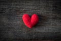 Alone handmade red heart on wooden background. Royalty Free Stock Photo