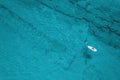 Alone man rowing on SUP board on aquamarine, blue sea water with coral in lagoon. Aerial top view paddleboard. Surfing. Royalty Free Stock Photo