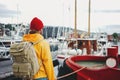 Alone man traveler wearing yellow jacket explore authentic nord town while journey