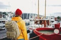 Alone man traveler wearing yellow jacket explore authentic nord town while journey Royalty Free Stock Photo