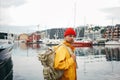 Alone man traveler wearing yellow jacket explore authentic nord town while journey Royalty Free Stock Photo