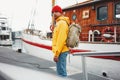 Alone man traveler wearing yellow jacket explore authentic nord town while journey Royalty Free Stock Photo