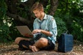 Alone office worker with laptop on desert island Royalty Free Stock Photo