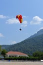 Alone paraglider flying in the blue sky against the background of clouds. Paragliding in the sky on a sunny day Royalty Free Stock Photo