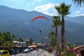 Alone paraglider flying in the blue sky against the background of clouds. Paragliding in the sky on a sunny day Royalty Free Stock Photo