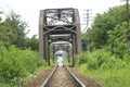 Woman buddhist monk walking along a railway Royalty Free Stock Photo