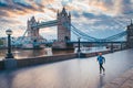 Alone runner in empty streets of london in Coronavirus, Covid-19 quarantine time. Tower Bridge in background Royalty Free Stock Photo