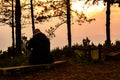 Alone and sad man has sitting on the wooden with sunset time on Royalty Free Stock Photo