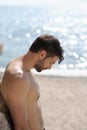 Alone sad man profile portrait on a sea beach Royalty Free Stock Photo