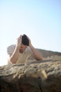 Alone sad man sitting on a sea beach Royalty Free Stock Photo