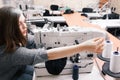 Alone seamstress overworking at garment factory