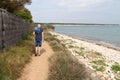 Alone senior man walking on path beach in Saint Vincent sur Jard in VendÃÂ©e Pays de la Loire France
