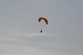 Paramotor in flight, Paraglider flying against the sunset sky Royalty Free Stock Photo