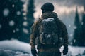 Alone soldier, standing with a backpack, against the backdrop of a winter landscape