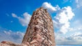 Alone standing fort with ruins monument with attractive scattering pebbles sight. Ancient fort column closeup shot