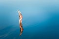 Alone stretching girl in water Royalty Free Stock Photo