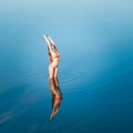 Alone stretching girl in water Royalty Free Stock Photo