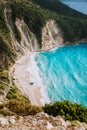 Alone tourist tent on famous Myrtos Beach. Big foam waves rolling towards the bay. Kefalonia, Greece Royalty Free Stock Photo