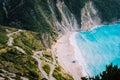 Alone tourist tent on famous Myrtos Beach. Big foam waves rolling towards the bay. Kefalonia, Greece Royalty Free Stock Photo