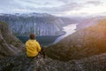 Alone tourist on Trolltunga rock Royalty Free Stock Photo