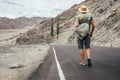 Alone traveler walks on the mountain road in indian Himalaya mou