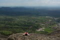 Alone woman lies high in the mountains enjoy the view